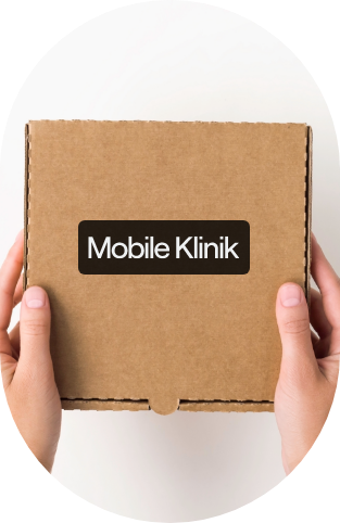person holding a box that with the mobile klinik logo on it