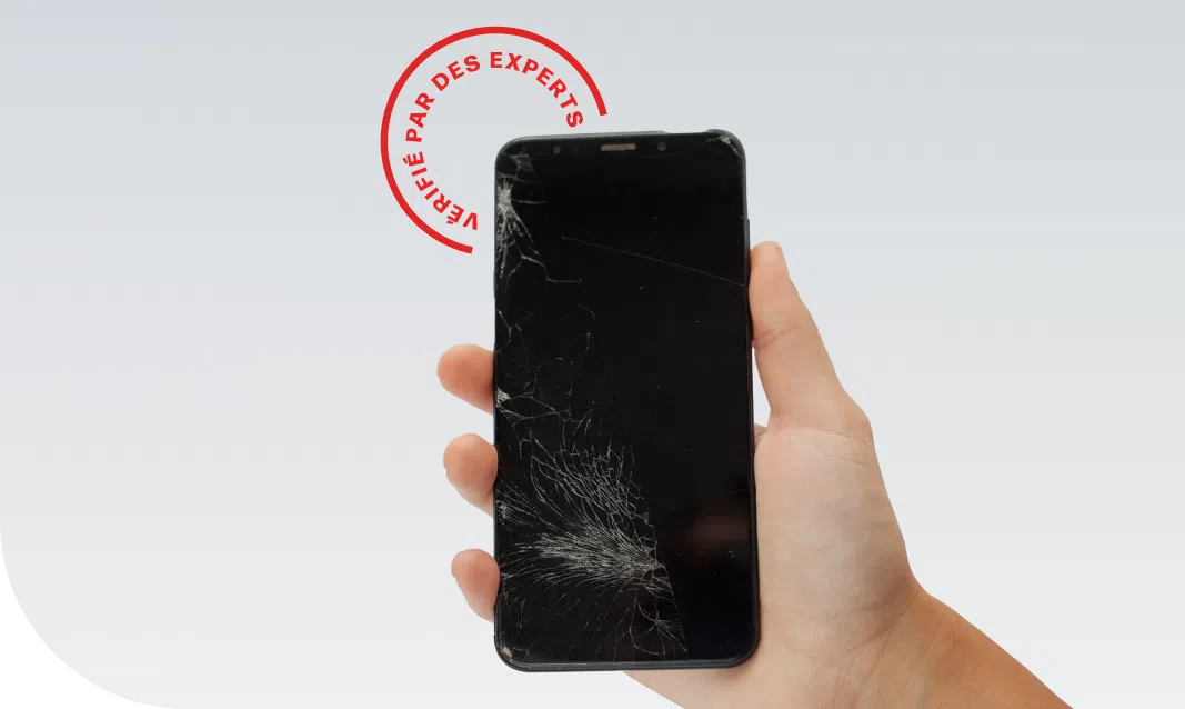 person holding a shattered phone