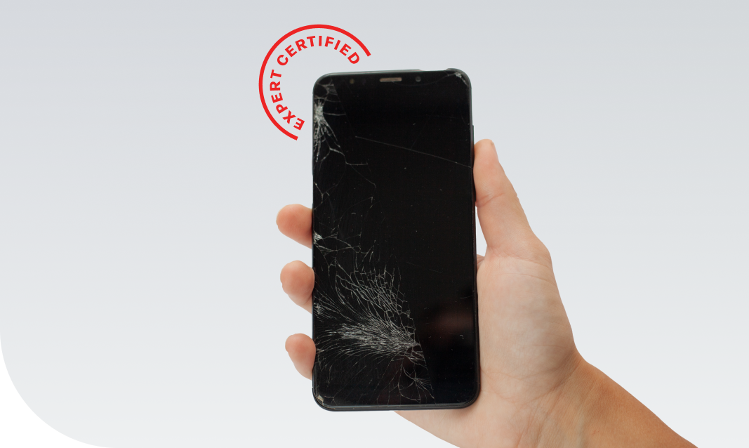 person holding a shattered phone