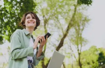 Person smiling while using phone