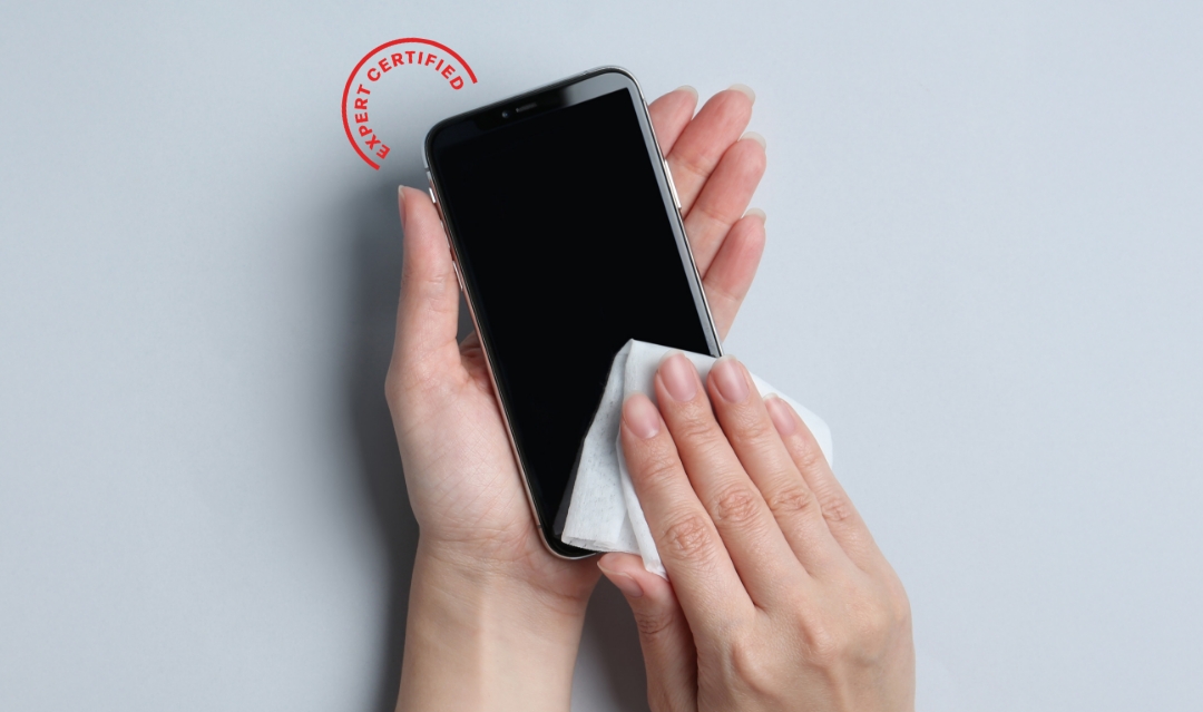 Person cleaning phone