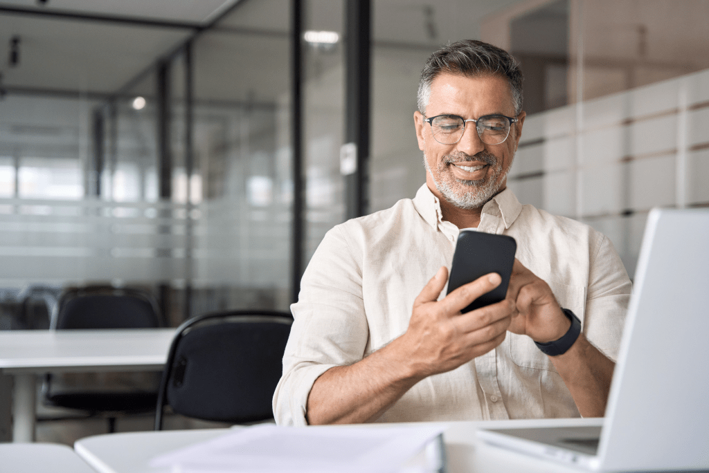 Person smiling while using their phone