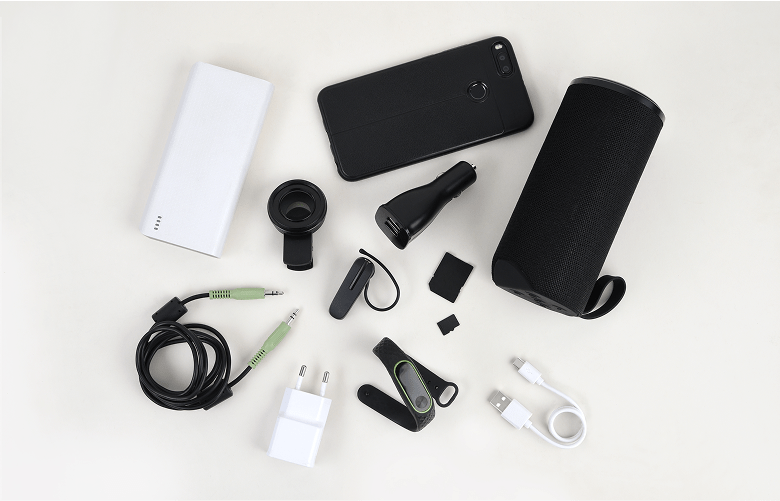 A flat lay of a phone surrounded by multiple different types of accessories