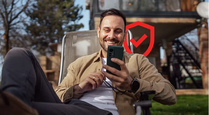 Person sitting down and using their phone