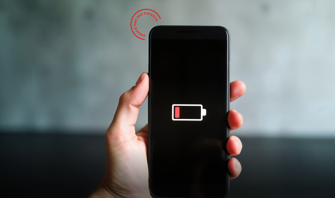 Person holding a phone with the battery running out