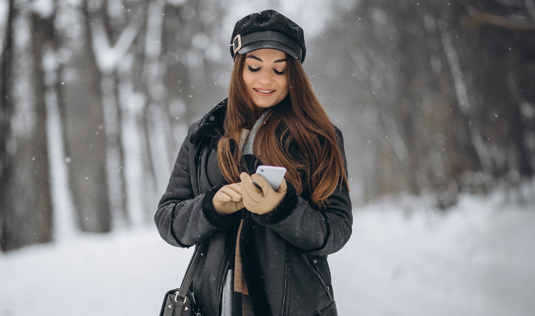 Woman on her phone outside